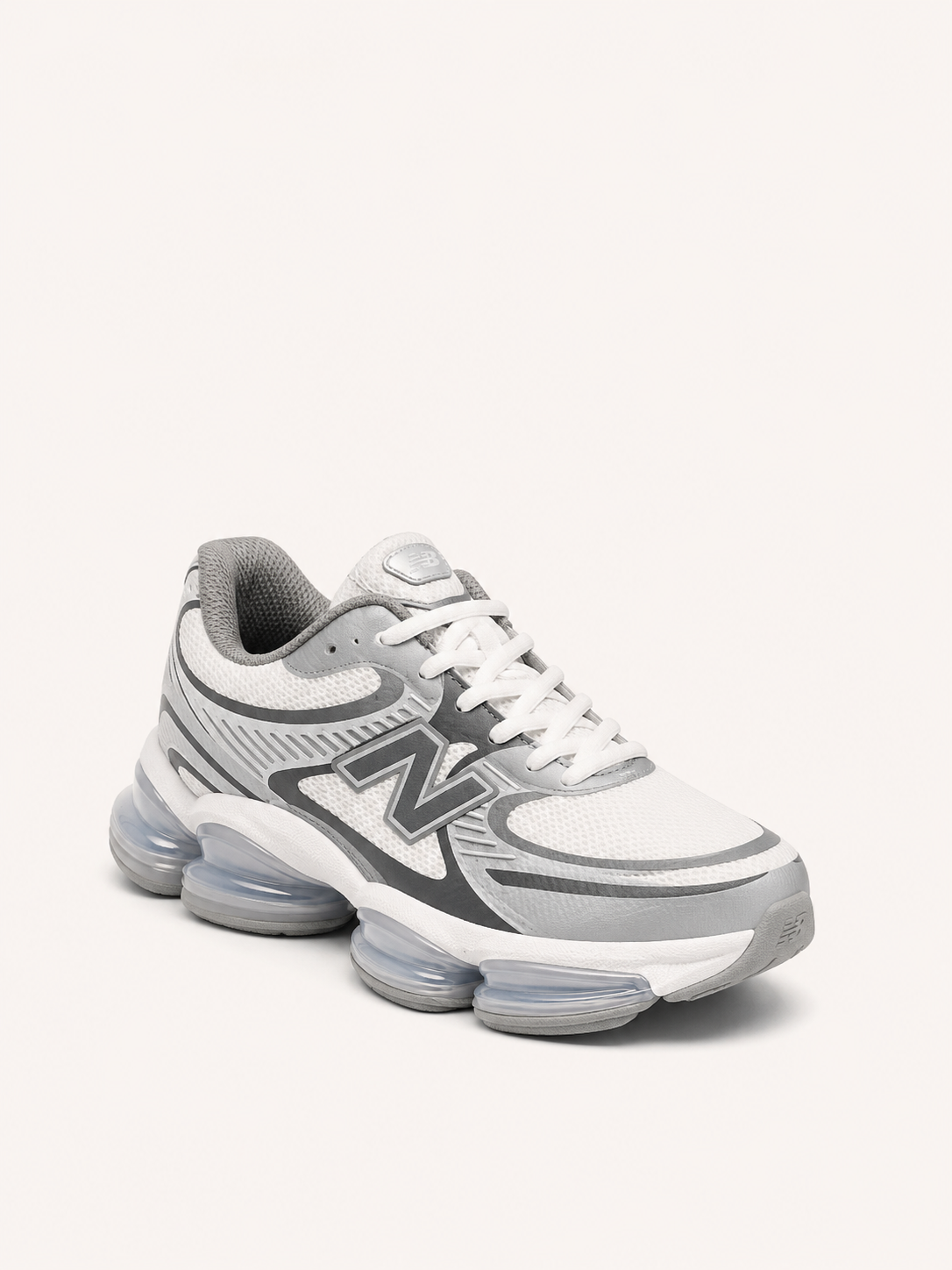 NEW BALANCE 1906 BLANCA PLATEADA