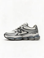 NEW BALANCE 1906 BLANCA PLATEADA